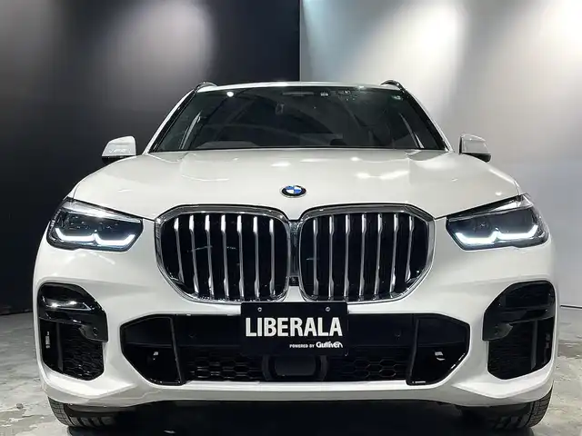 ＢＭＷ Ｘ５ xDrive 35d Mスポーツ 道央・札幌 2022(令4)年 1.9万km アルピンホワイトⅢ ハイラインpkg/　・アッシュ・グレイン・ブラウン・ファイン・ウッド・トリム/レザー・フィニッシュ・ダッシュボード/ドライビング・アシスト・プロフェッショナル/　・ACC/　・レーン・ディパーチャー・ウォーニング/　・レーン・チェンジ・ウォーニング/　・レーン・チェンジ・アシスト/パーキング・アシスト・プラス/　・PDC/　・パーキングアシスト/　・パノラマ・サイド・ビューカメラ/電動シート/シートヒーター/BMWヘッドアップディスプレイ/ワイヤレスチャージング/アンビエントライト/アダプティブLEDヘッドライト/オートライト/レインセンサー/オートマチック・テールゲート/ヒルディセントコントロール/ETC/取扱説明書、スペアキー1本有