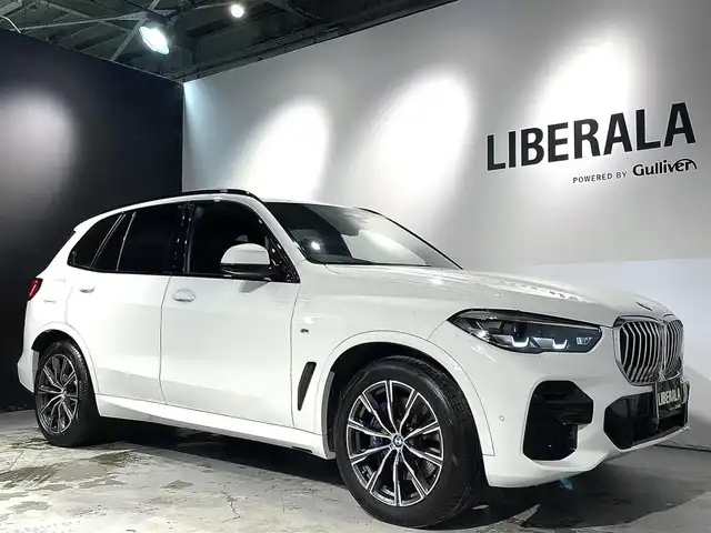 ＢＭＷ Ｘ５ xDrive 35d Mスポーツ 道央・札幌 2022(令4)年 1.9万km アルピンホワイトⅢ ハイラインpkg/　・アッシュ・グレイン・ブラウン・ファイン・ウッド・トリム/レザー・フィニッシュ・ダッシュボード/ドライビング・アシスト・プロフェッショナル/　・ACC/　・レーン・ディパーチャー・ウォーニング/　・レーン・チェンジ・ウォーニング/　・レーン・チェンジ・アシスト/パーキング・アシスト・プラス/　・PDC/　・パーキングアシスト/　・パノラマ・サイド・ビューカメラ/電動シート/シートヒーター/BMWヘッドアップディスプレイ/ワイヤレスチャージング/アンビエントライト/アダプティブLEDヘッドライト/オートライト/レインセンサー/オートマチック・テールゲート/ヒルディセントコントロール/ETC/取扱説明書、スペアキー1本有