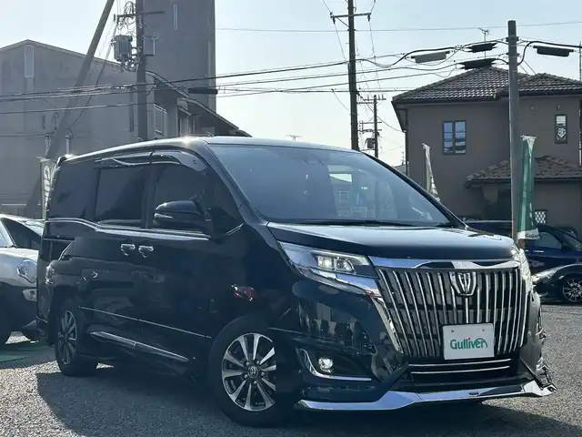 トヨタ エスクァイア Gi 兵庫県 2021(令3)年 3.9万km ブラッキッシュアゲハガラスフレーク ・モデリスタエアロ/・純正10インチナビ/・地デジ/DVD/BT/USB/HDMI/・ステアリングリモコン/・純正12.1型フリップダウンモニター（V12T-R68C）/・バックカメラ/・合皮シート/・前シートヒーター/・純正15インチAW/・オートLEDヘッドランプ/・LEDフォグランプ/・ビルトインETC/・両側パワースライドドア/・クルーズコントロール/・プリクラッシュセーフティ/・オートマチックハイビーム/・レーンディパーチャーアラート/・パーキングサポートブレーキ/・クリアランスソナー