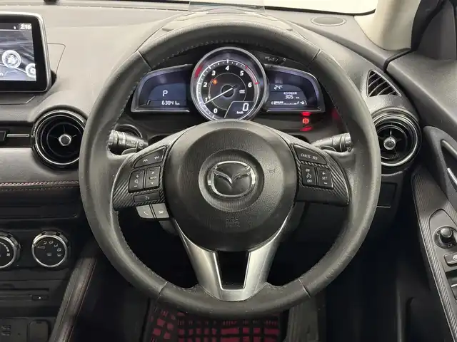マツダ デミオ XD ツーリング 愛知県 2015(平27)年 6.4万km ソウルレッドプレミアムメタリック ディーゼルターボ/FF/MTモード付フロア6AT/純正 7インチナビ/（FM/AM/aha/Stitcher/Bluetooth/USBx2/CD/AUX/DVD/TV）/【OP】CD/DVDプレーヤー＋地上デジタルTVチューナー（フルセグ）/バックカメラ/リヤスポイラー/ドライブレコーダー 前方/ETC/安全/・スマートシティブレーキサポート［SCBS］/・【OP】車線逸脱警報システム［LDWS］*1/・【OP】ブラインド・スポット・モニタリングシステム［BSM］*1/・【OP】リア・クロス・トラフィック・アラート機能［RCTA］*1/・横滑り防止機能/装備/【OP】セーフティパッケージ*1/●ハイ・ビーム・コントロール・システム［HBC］/・クルーズコントロール/・オートエアコン/・オートライト/・LEDヘッドライト/・フロントフォグランプ/・レインセンサー・ワイパー（雨滴検知式フロントオートワイパー）/・パドルシフト/・ステアリングスイッチ/・プッシュスタート/・純正16inAW/・H30/R2/R4点検記録簿/・保/取/*1…セットでメーカーOP