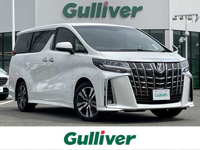 トヨタ アルファード S Cパッケージ 佐賀県 2022(令4)年 4.4万km ホワイトパールクリスタルシャイン 純正9インチディスプレイオーディオ/・フルセグTV/CD/DVDUSB/Bluetooth/純正12インチフリップダウンモニター/バックカメラ/前後ドライブレコーダー/ビルトインETC/両側パワースライドドア/パワーバックドア/リバース連動ドアミラー/後席エアコン/電子パーキングブレーキ/AUTO HOLD機能/合皮シート/DNセカンド席パワーシート(D席メモリー機能付)/DN席シートヒーター/シートベンチレーション/N席セカンド席電動オットマン/キャプテンシート/後席サンシェード/ISOFIX対応/木目調革巻きステアリング/ステアリングヒーター/ステアリングリモコン/純正18インチアルミホイール/純正三眼LEDヘッドライト/・オートマチックハイビーム/純正LEDフォグランプ/新車保証書/取扱説明書/スペアキー１本/トヨタセーフティセンス/・レーダークルーズコントロール/・レーントレーシングアシスト/・クリアランスソナー/・パーキングサポートブレーキ/・プリクラッシュセーフティ/・ロードサインアシスト