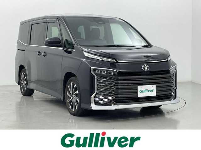 トヨタ ヴォクシー S－Z 熊本県 2022(令4)年 3.5万km グリッターブラックガラスフレーク セーフティセンス（衝突回避支援パッケージ）/・プリクラッシュセーフティ/・レーンディパーチャーアラート/・オートマチックハイビーム/・ドライバー異常時対応システム/・発進遅れ告知機能/・レーントレーシングアシスト/・レーダークルーズコントロール/・ロードサインアシスト/・プロアクティブドライビングアシスト/純正10.5インチディスプレイオーディオ/・車載メモリーナビ/・DVD/CD/・12スピーカー/・USB入力/・Apple CarPlay / Android Auto/・ETC2.0ユニット/・AM/ワイドFMチューナー/・地デジTV/・HDMI入力/・バックカメラ/純正13.2型有機EL後席モニター/両側パワースライドドア/LEDヘッドライト/ビルトインETC/ハーフレザーシート/前後コーナーセンサー/スマートキー