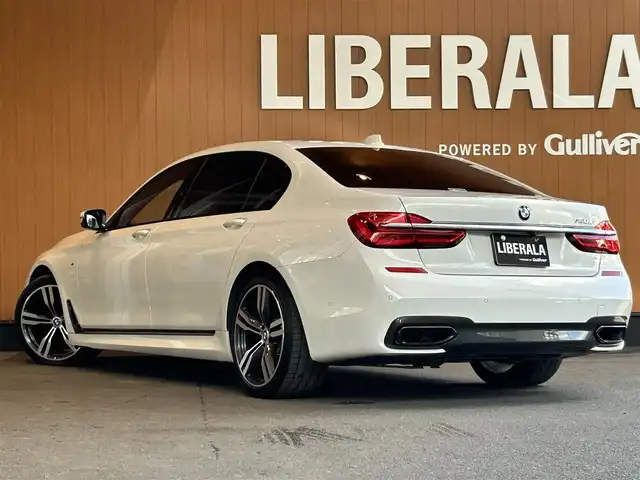 ＢＭＷ ７５０Ｌｉ Mスポーツ 宮城県 2016(平28)年 5万km ミネラルホワイト リヤコンフォートパッケージ/スカイラウンジガラスサンルーフ/リヤエンターテイメントシステム/アクティブクルーズコントロール/レーンキープアシスト/レーンチェンジウォーニング/ヘッドアップディスプレイ/harman/kardon/iDriveナビゲーションシステム/フルセグTV/全方位カメラ/ブラックレザーシート/シートベンチレーション/シートヒーター/メモリ機能付きパワーシート/純正20インチAW/レーザーライトLEDヘッドライト/後席専用タブレット