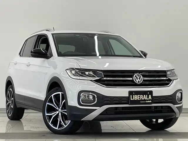 フォルクスワーゲン Ｔ－クロス TSI 1stプラス 岡山県 2020(令2)年 5.1万km ピュアホワイト オールインセーフティ（予防安全装備）/プリクラッシュブレーキ/AAC/レーンキープアシスト/ブラインドスポット/リアトラフィックアラート/ドライバー疲労検知/ハイビームアシスト/パークアシスト/PDC/リアビューカメラ/LEDヘッドライト/純正ナビ/フルセグTV/AppleCarPlay/ETC/純正18インチAW