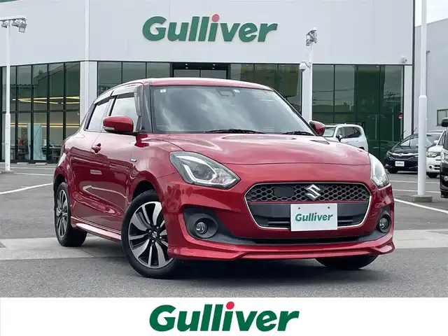 スズキ スイフト HYBRID RS 愛媛県 2017(平29)年 5.7万km バーニングレッドPM 登録時走行距離：56726km/ECLIPSE製7インチナビ/CD/DVD/フルセグTV/Bluetooth/バックカメラ/ETC/衝突被害軽減システム/横滑り防止装置/レーンキープアシスト/クルーズコントロール/アイドリングストップ/LEDヘッドライト/フォグランプ/オートライト/運転席シートヒーター/パドルシフト/エンジンスタートボタン/スマートキー/社外フロアマット/純正フ16インチアルミホイール