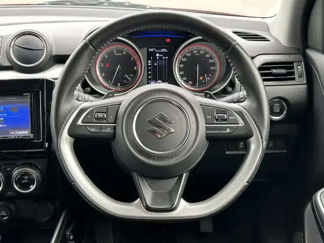 スズキ スイフト HYBRID RS 愛媛県 2017(平29)年 5.7万km バーニングレッドPM 登録時走行距離：56726km/ECLIPSE製7インチナビ/CD/DVD/フルセグTV/Bluetooth/バックカメラ/ETC/衝突被害軽減システム/横滑り防止装置/レーンキープアシスト/クルーズコントロール/アイドリングストップ/LEDヘッドライト/フォグランプ/オートライト/運転席シートヒーター/パドルシフト/エンジンスタートボタン/スマートキー/社外フロアマット/純正フ16インチアルミホイール