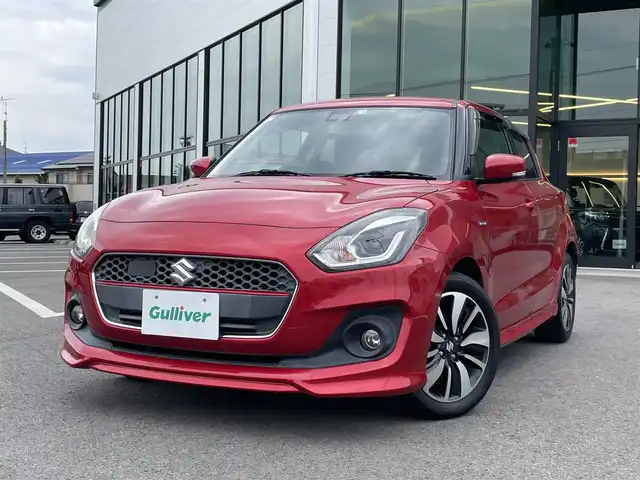 スズキ スイフト HYBRID RS 愛媛県 2017(平29)年 5.7万km バーニングレッドPM 登録時走行距離：56726km/ECLIPSE製7インチナビ/CD/DVD/フルセグTV/Bluetooth/バックカメラ/ETC/衝突被害軽減システム/横滑り防止装置/レーンキープアシスト/クルーズコントロール/アイドリングストップ/LEDヘッドライト/フォグランプ/オートライト/運転席シートヒーター/パドルシフト/エンジンスタートボタン/スマートキー/社外フロアマット/純正フ16インチアルミホイール