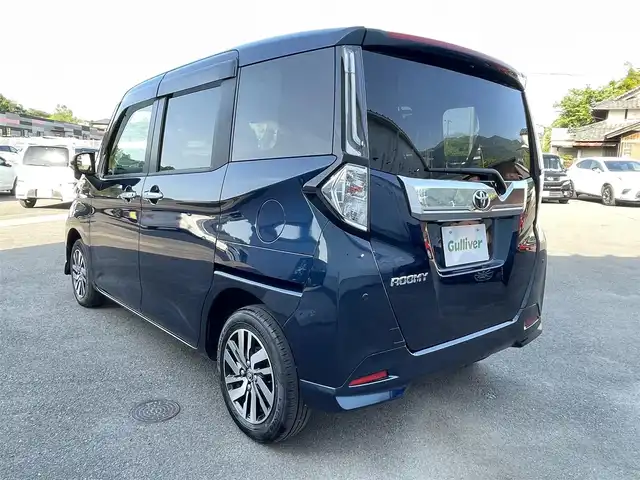 トヨタ ルーミー カスタムG 愛媛県 2023(令5)年 1.8万km レーザーブルークリスタルシャイン スマートアシスト/衝突回避支援ブレーキ/車線逸脱警報/ブレーキ制御付御発進抑制機能/アダプティブクルーズコントロール/先行車発進お知らせ機能/ふらつき警報/路外逸脱警報/標識認識機能/社外7インチナビ【AVN-R10W】/　CD/DVD/Bluetooth/フルセグTV/ビルトインETC/両側パワースライドドア/オートライト/LEDヘッドライト/フロントフォグ/革巻きステアリング/電子パーキングブレーキ/フロアマット/ドアバイザー