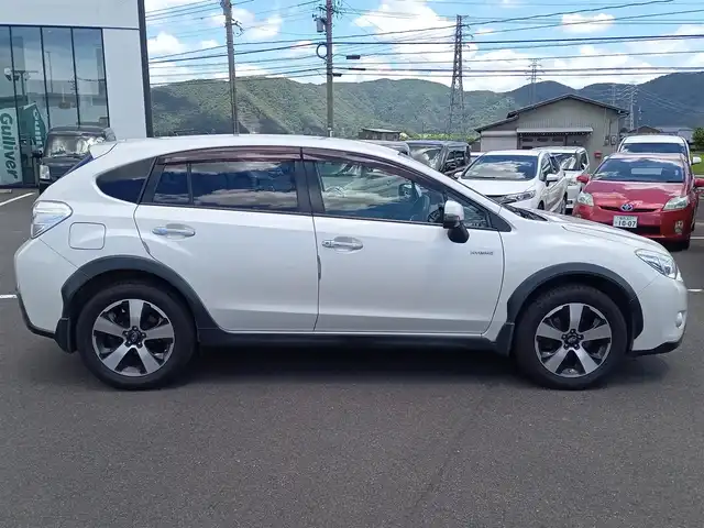 スバル インプレッサ ＸＶ ハイブリッド 2．0i－L アイサイト 福井県 2014(平26)年 12万km サテンホワイトパール 衝突被害軽減システム/メモリナビ（AVIC-MRZ099W）/・（CD/DVD/Bluetooth）/バックカメラ/ETC/パドルシフト/ステアリングスイッチ/前席パワーシート/冬用スタッドレスタイヤ積込/純正フロアマット/スマートキー