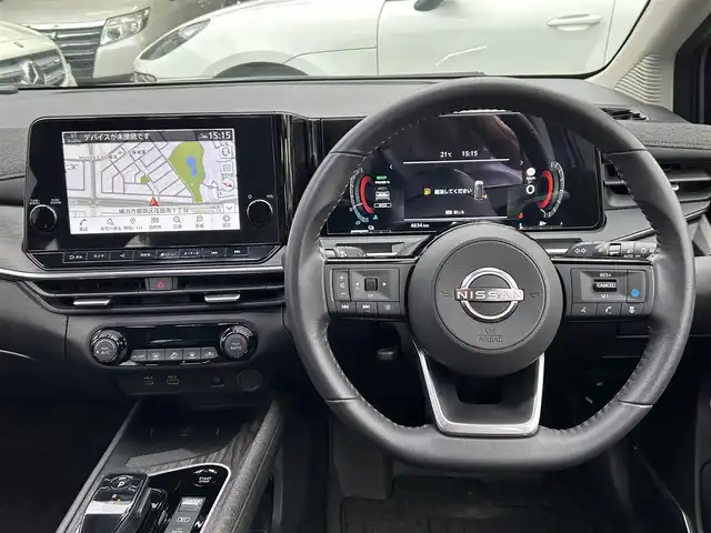 日産 オーラ G レザーエディション 神奈川県 2024(令6)年 0.5万km グレー NissanConnectナビ・フルセグ・USB・Bluetooth・AppleCarPlay/BOSEパーソナルプラスサウンドシステム/ビルトインETC2.0/USB電源ソケット（タイプC（フロント、リア）、タイプA（フロント））/ワイヤレス充電/プロパイロット（ナビリンク機能付）/プロパイロット緊急停止支援システム（SOSコール機能付）/インテリジェントエマージェンシーブレーキ/踏み間違い衝突防止アシスト/標識検知機能/前方衝突予測警報/車線逸脱警報/ふらつき警報/車線逸脱防止支援システム/フロント＆バックソナー/エマージェンシーストップシグナル/後側方衝突防止支援システム/後側方車両検知警報/後退時車両検知警報/車両接近追放装置/革巻きステアリング/ステアリングスイッチ/本革シート/運転席パワーシート/純正ドライブレコーダー/インテリジェントルームミラー/オートブレーキホールド/LEDヘッドライト/LEDフォグランプ/純正17インチアルミ/純正フロアマット/保証書/取扱説明書/インテリジェントキー×2