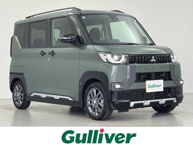 三菱 デリカミニ T プレミアム 愛知県 2025(令7)年 0.1千km Ｄグリーン 届出済未使用車　14km/MI-PILOT/純正9型ディスプレイオーディオ/・Bluetooth/AppleCarPlay/AndoroidAuto/全方位カメラ/両側電動スライドドア/ハーフレザー/クリアランスソナー/LEDヘッドライト/オートハイビーム/レーンキープ/前席シートヒーター（D/N）/ステアリングヒーター/ヒルディセントコントロール/電動パーキングブレーキ/オートブレーキホールド/プッシュスタート/スマートキー/スペアキー1本/ステアリングリモコン/DiM