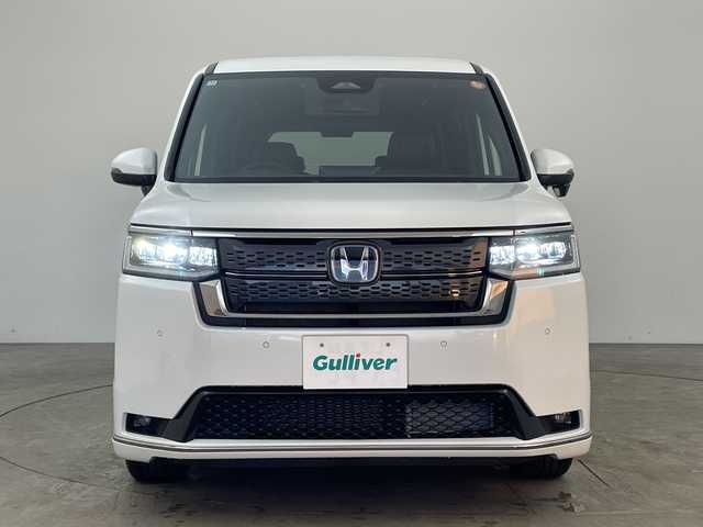 ホンダ ステップワゴン スパーダ eHEV 兵庫県 2025(令7)年 0.1千km プラチナホワイトパール ・登録済未使用車 距離5Km/・純正11.4インチナビ（LXM-247VFLi）/TV/Bluetooth/CD/DVD/USB/・純正15.6インチフリップダウンモニター（VM-231FE）/・バックカメラ/・Honda　SENSING/衝突軽減ブレーキ/先行車発進お知らせ機能/歩行者事故低減ステアリング/路外逸脱抑制機能/標識認識機能/アダプティブクルーズコントロール/車線維持支援システム/トラフィックジャムアシスト/ブラインドスポットインフォメーション/誤発進抑制機能/後方誤発進抑制機能/近距離衝突軽減ブレーキ/急アクセル抑制機能/パーキングセンサーシステム/オートハイビーム/・両側パワースライドドア/・パワーバックドア/・パドルシフト/・ハーフレザーシート/・全列USBチャージャー/・前席シートヒーター/・2列目オットマン/・LEDヘッドライト/・フォグランプ/・純正16インチアルミホイール/・スマートキー