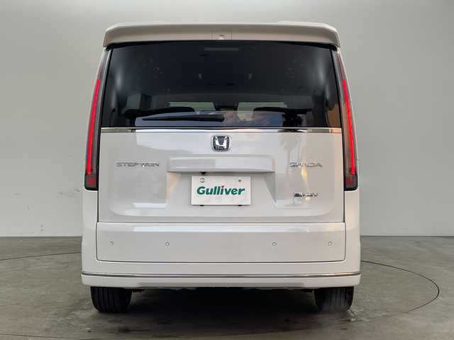 ホンダ ステップワゴン スパーダ eHEV 兵庫県 2025(令7)年 0.1千km プラチナホワイトパール ・登録済未使用車 距離5Km/・純正11.4インチナビ（LXM-247VFLi）/TV/Bluetooth/CD/DVD/USB/・純正15.6インチフリップダウンモニター（VM-231FE）/・バックカメラ/・Honda　SENSING/衝突軽減ブレーキ/先行車発進お知らせ機能/歩行者事故低減ステアリング/路外逸脱抑制機能/標識認識機能/アダプティブクルーズコントロール/車線維持支援システム/トラフィックジャムアシスト/ブラインドスポットインフォメーション/誤発進抑制機能/後方誤発進抑制機能/近距離衝突軽減ブレーキ/急アクセル抑制機能/パーキングセンサーシステム/オートハイビーム/・両側パワースライドドア/・パワーバックドア/・パドルシフト/・ハーフレザーシート/・全列USBチャージャー/・前席シートヒーター/・2列目オットマン/・LEDヘッドライト/・フォグランプ/・純正16インチアルミホイール/・スマートキー