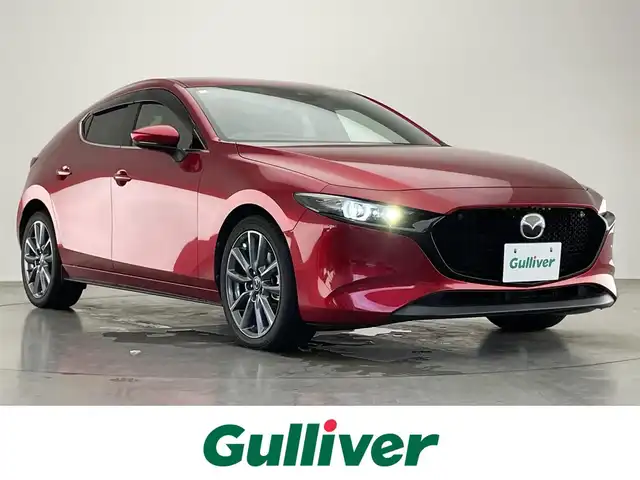 マツダ マツダ３ファストバック XD バーガンディセレクション 愛知県 2020(令2)年 4.7万km ソウルレッドクリスタルM 純正ナビ/フルセグTV/Bluetooth/DVD/CD/HDMI/前後ドライブレコーダー/アラウンドビューモニター/クルーズコントロール/ETC/プッシュスタート/革巻きハンドル/赤革シート/D席パワーシート（メモリ機能つき）/ステアリングスイッチ/ステアリングヒーター/衝突被害軽減機能/ブラインドスポットモニター/レーンキープアシスト/ドライバーモニタリングカメラ/標識認識機能/オートライト/オートマチックハイビーム/LEDヘッドライト/盗難防止装置/純正アルミホイール/保証書・取扱説明書