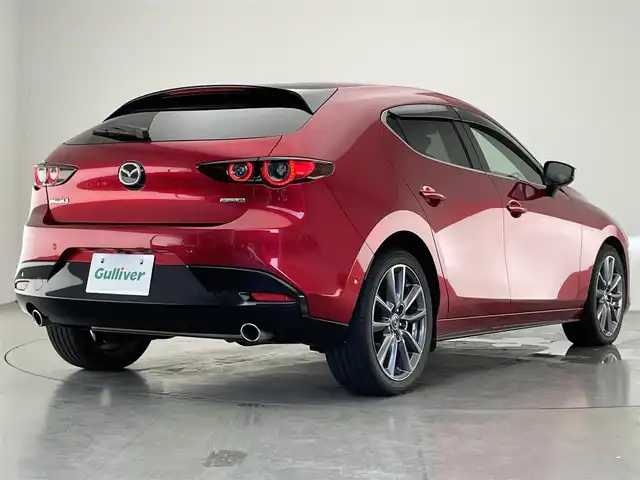 マツダ マツダ３ファストバック XD バーガンディセレクション 愛知県 2020(令2)年 4.7万km ソウルレッドクリスタルM 純正ナビ/フルセグTV/Bluetooth/DVD/CD/HDMI/前後ドライブレコーダー/アラウンドビューモニター/クルーズコントロール/ETC/プッシュスタート/革巻きハンドル/赤革シート/D席パワーシート（メモリ機能つき）/ステアリングスイッチ/ステアリングヒーター/衝突被害軽減機能/ブラインドスポットモニター/レーンキープアシスト/ドライバーモニタリングカメラ/標識認識機能/オートライト/オートマチックハイビーム/LEDヘッドライト/盗難防止装置/純正アルミホイール/保証書・取扱説明書