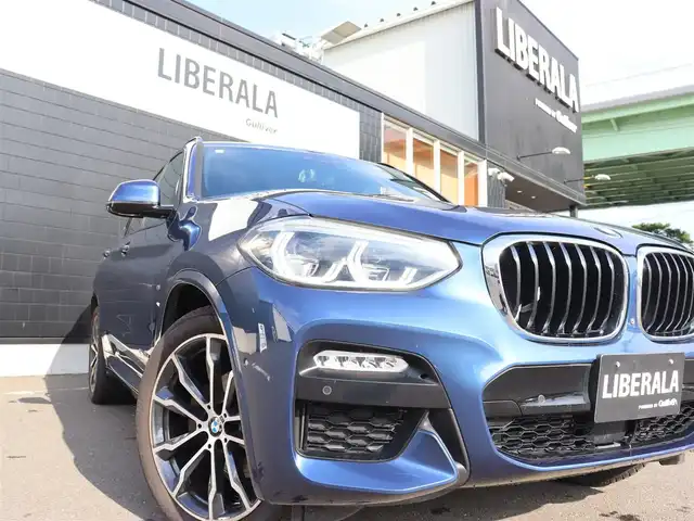 ＢＭＷ Ｘ３ xDrive20d Mスポーツ 宮城県 2018(平30)年 5万km 青 純正ナビ【ＢＴ／ＣＤ／ＤＶＤ／フルセグＴＶ／ＵＳＢ】/アダプティブクルーズコントロール　/インテリジェントセーフティ/ワイヤレス充電　/ヘッドアップディスプレイ/ハーフレザーシート　/前席パワーシート/D席メモリー付き/パドルシフト　/パノラマビューモニター/バックカメラ　/前席シートヒーター　/オートホールド/ルーフレール/パーキングアシスト/ドライビングモードスイッチ/パワーバックドア/純正20インチAW/ディスプレイキー/ダウンヒルアシストコントロール/ミラー一体型ETC/LEDヘッドライト/前後コーナーセンサー/禁煙車