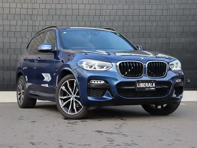 ＢＭＷ Ｘ３ xDrive20d Mスポーツ 宮城県 2018(平30)年 5万km 青 純正ナビ【ＢＴ／ＣＤ／ＤＶＤ／フルセグＴＶ／ＵＳＢ】/アダプティブクルーズコントロール　/インテリジェントセーフティ/ワイヤレス充電　/ヘッドアップディスプレイ/ハーフレザーシート　/前席パワーシート/D席メモリー付き/パドルシフト　/パノラマビューモニター/バックカメラ　/前席シートヒーター　/オートホールド/ルーフレール/パーキングアシスト/ドライビングモードスイッチ/パワーバックドア/純正20インチAW/ディスプレイキー/ダウンヒルアシストコントロール/ミラー一体型ETC/LEDヘッドライト/前後コーナーセンサー/禁煙車