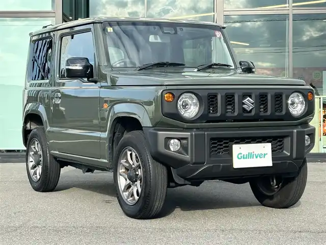 スズキ ジムニー XC 愛媛県 2023(令5)年 4.3万km ジャングルグリーン 社外ナビ(Bluetooth/フルセグTV)/クルーズコントロール/バックカメラ/前後ドライブレコーダー/背面タイヤ(BRIDGESTONE DUELER H/L)/純正16インチAW/オートLEDヘッドライト/フォグランプ/４WD切り替え/前席シートヒーター/ヒートミラー/ステアリングリモコン/横滑り防止装置/レーンキープアシスト/ダウンヒルアシストコントロール/ABS