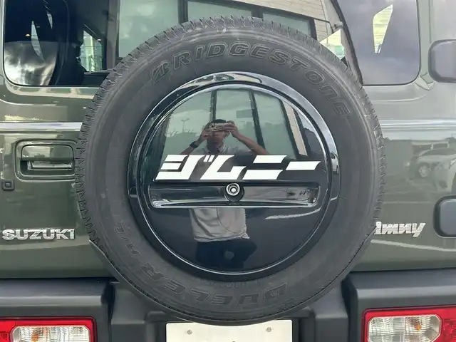 スズキ ジムニー XC 愛媛県 2023(令5)年 4.3万km ジャングルグリーン 社外ナビ(Bluetooth/フルセグTV)/クルーズコントロール/バックカメラ/前後ドライブレコーダー/背面タイヤ(BRIDGESTONE DUELER H/L)/純正16インチAW/オートLEDヘッドライト/フォグランプ/４WD切り替え/前席シートヒーター/ヒートミラー/ステアリングリモコン/横滑り防止装置/レーンキープアシスト/ダウンヒルアシストコントロール/ABS