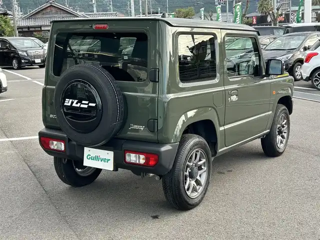 スズキ ジムニー XC 愛媛県 2023(令5)年 4.3万km ジャングルグリーン 社外ナビ(Bluetooth/フルセグTV)/クルーズコントロール/バックカメラ/前後ドライブレコーダー/背面タイヤ(BRIDGESTONE DUELER H/L)/純正16インチAW/オートLEDヘッドライト/フォグランプ/４WD切り替え/前席シートヒーター/ヒートミラー/ステアリングリモコン/横滑り防止装置/レーンキープアシスト/ダウンヒルアシストコントロール/ABS
