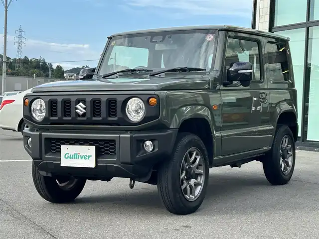 スズキ ジムニー XC 愛媛県 2023(令5)年 4.3万km ジャングルグリーン 社外ナビ(Bluetooth/フルセグTV)/クルーズコントロール/バックカメラ/前後ドライブレコーダー/背面タイヤ(BRIDGESTONE DUELER H/L)/純正16インチAW/オートLEDヘッドライト/フォグランプ/４WD切り替え/前席シートヒーター/ヒートミラー/ステアリングリモコン/横滑り防止装置/レーンキープアシスト/ダウンヒルアシストコントロール/ABS