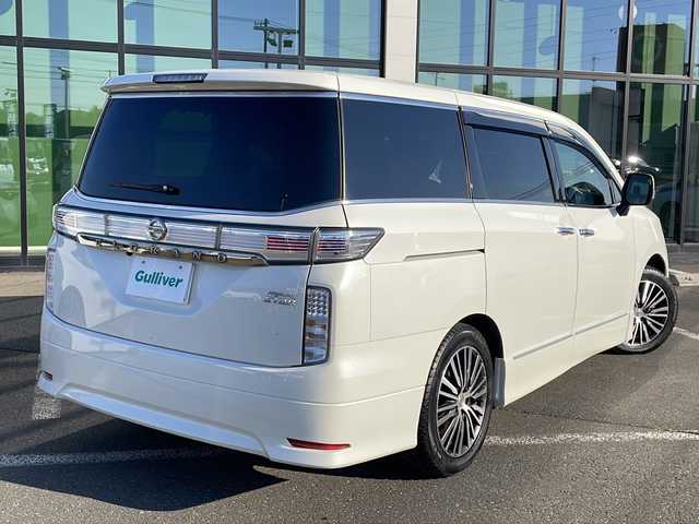 日産 エルグランド 350ハイウェイスター 道東・釧路十勝 2014(平26)年 11.3万km ブリリアントホワイトパール ・スマートキー/・純正エンジンスターター/・7インチ社外ナビ(AM/FM/CD/DVD/TV/BT)/・両側パワースライドドア/・４WD/・パワーバックドア/・電格ミラー/・ドアバイザー/・純正フロアマット/・純正エアロ(フロント/サイド/リア)/・クルーズコントロール/・イエローフォグランプ/・社外10インチフリップダウン/・ハーフレザーシート/・オットマン/・バックカメラ