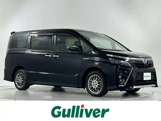 トヨタ ヴォクシー ハイブリッド ZS 煌Ⅱ 佐賀県 2019(令1)年 4.5万km ブラック 純正ディーラーオプション9インチナビ/バックカメラ/フルセグテレビ　/CD/DVD/BT/SD/FM.AM/プリクラッシュセーフティ/レーンディパーチャーアラート/オートハイビーム/クルーズコントロール/シートヒーター/純正ドライブレコーダー/純正フロアマット/純正ドアバイザー/プッシュスタート