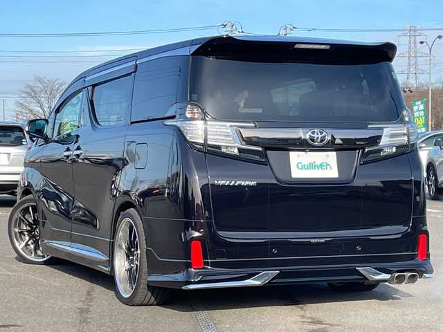 トヨタ ヴェルファイア 2.5Z Aエディデョン ゴールデンアイズ 道央・札幌 2017(平29)年 3万km バーニングブラッククリスタルシャインガラスフレーク ４WD/モデリスタエアロ/社外足廻り（ダウンサス）/純正ディーラーOPナビ/CD/DVD/BT/フルセグ/純正フリップダウンモニター/横滑り防止装置/クルーズコントロール/パーキングアシスト/クリアランスソナー/バック/フロントカメラ/ビルトインETC/ドライブレコーダー/アイドリングストップ/ECOMODE/nanoe/両側パワースライドドア/パワーバックドア/N席/２列目オットマン/ハーフレザーシート/革巻きウッドコンビステアリング/ステアリングリモコン/AC100V/電動パーキング/ブレーキホールド/MTモード付AT/プッシュスタート/スマートキー/LEDヘッドライト/オートライト/フォグランプ/電動格納ミラー/ウィンカーミラー/純正フロアマット/ドアバイザー/サスペンション/グリル積込
