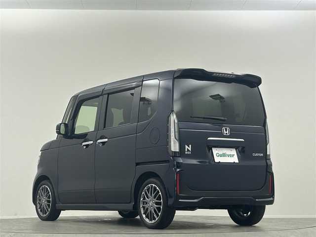 ホンダ Ｎ ＢＯＸ カスタム ターボ 埼玉県 2024(令6)年 0.3万km ミッドナイトブルービームM 純正９型ナビ　１２．８型後席モニター　両側パワースライドドア Bluetooth バックカメラ ハーフレザーシート レーダークルーズコントロール オートマチックハイビーム シートヒーター