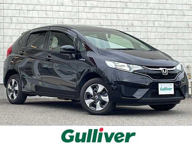 ホンダ フィット ハイブリット Fパッケージ 福島県 2016(平28)年 7.4万km クリスタルブラックパール 純正ナビ　バックＣ　ＢＴ　ワンセグＴＶ　ワイパーデザイアー　ＥＴＣ　ステリモ　ハロゲンヘッドライト　電格ミラー　スペアキー　前方ドラレコ　ＥＣＯＮ　純正ドアバイザー　純正ホイールキャップ　取扱説明書