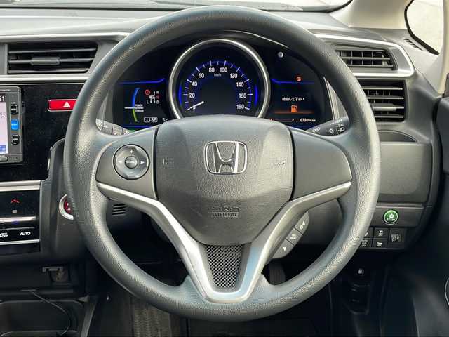 ホンダ フィット ハイブリット Fパッケージ 福島県 2016(平28)年 7.4万km クリスタルブラックパール 純正ナビ　バックＣ　ＢＴ　ワンセグＴＶ　ワイパーデザイアー　ＥＴＣ　ステリモ　ハロゲンヘッドライト　電格ミラー　スペアキー　前方ドラレコ　ＥＣＯＮ　純正ドアバイザー　純正ホイールキャップ　取扱説明書