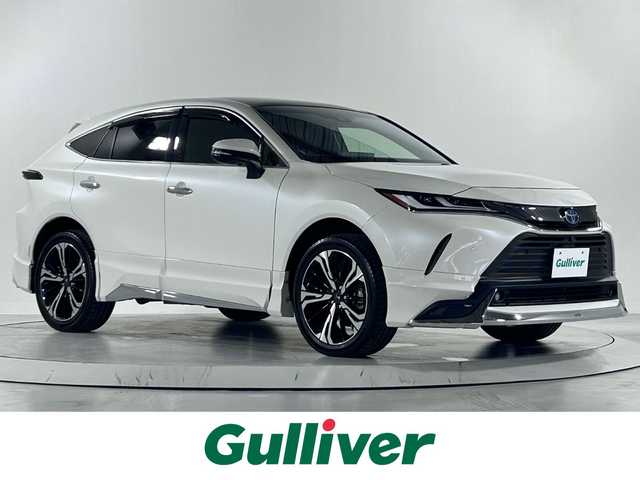 トヨタ ハリアー ハイブリッド Z レザーパッケージ 佐賀県 2022(令4)年 0.6万km ホワイトパールクリスタルシャイン 純正メモリナビ/フルセグTV/Bluetooth/JBLサウンドシステム/ETC2.0/調光パノラマルーフ/デジタルインナーミラー/アラウンドビューモニター/レーダークルーズコントロール/運転席・助手席パワーシート/運転席・助手席シートベンチレーション/モデリスタエアロ（フロント・リア・サイド）/純正LEDヘッドライト/純正フロアマット/社外20インチアルミホイール（モデリスタ）/コーナーセンサー/衝突被害軽減システム