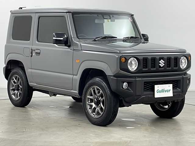 スズキ ジムニー XC 道央・札幌 2023(令5)年 0.3万km ミディアムグレー ・４ＷＤ/・寒冷地仕様/・社外９インチナビＴＶ＆ＢＴ＆ＤＶＤ＆ＣＤ＆ＵＳＢ＆ＨＤＭＩ/・バックカメラ/・スズキセーフティサポート/・ワンオーナー/・寒冷地仕様/・アイドリングストップ/・ダウンヒルアシスト/・クルーズコントロール/・横滑り防止機能/・２ＷＤ／４ＷＤ切り替え機能/・オートマチックハイビーム/・オートライト/・ＬＥＤヘッドライト/・フォグランプ/・社外ドライブレコーダー/・純正ＥＴＣ/・ドアミラーヒーター/・ミラーウィンカー