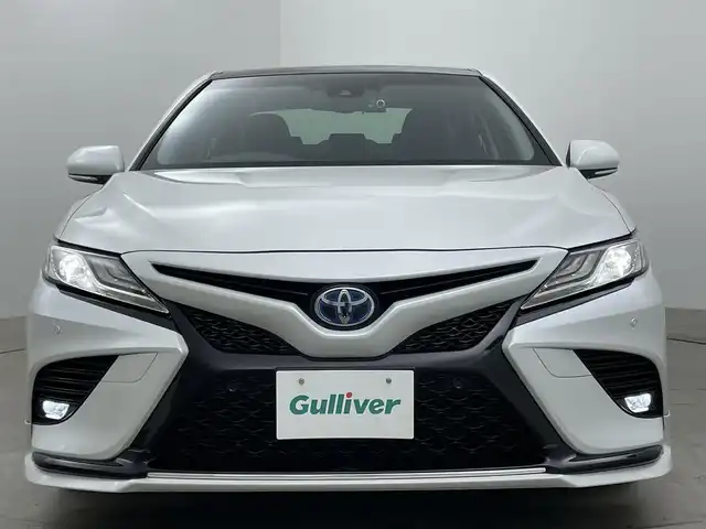 トヨタ カムリ WSレザーパッケージ 岡山県 2019(令1)年 6.7万km プラチナホワイトパールマイカ パノラマムーンルーフ/TRDエアロ（F/S/R）/純正8インチナビ/・バックカメラ/・FM/AM/Bluetooth/フルセグ/CD/DVD/レザーシート/・パワーシート/・シートヒーター/トヨタセーフティセンス/・プリクラッシュセーフティ/・レーンディパーチャーアラート/・レーダークルーズコントロール/・オートマチックハイビーム/・コーナーセンサー/・踏み間違い防止機能/ドライブレコーダー/ETC/純正18インチアルミ/純正フロアマット