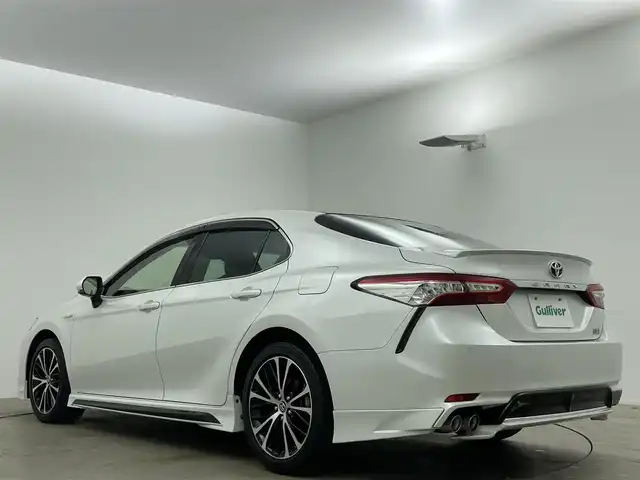 トヨタ カムリ WSレザーパッケージ 岡山県 2019(令1)年 6.7万km プラチナホワイトパールマイカ パノラマムーンルーフ/TRDエアロ（F/S/R）/純正8インチナビ/・バックカメラ/・FM/AM/Bluetooth/フルセグ/CD/DVD/レザーシート/・パワーシート/・シートヒーター/トヨタセーフティセンス/・プリクラッシュセーフティ/・レーンディパーチャーアラート/・レーダークルーズコントロール/・オートマチックハイビーム/・コーナーセンサー/・踏み間違い防止機能/ドライブレコーダー/ETC/純正18インチアルミ/純正フロアマット