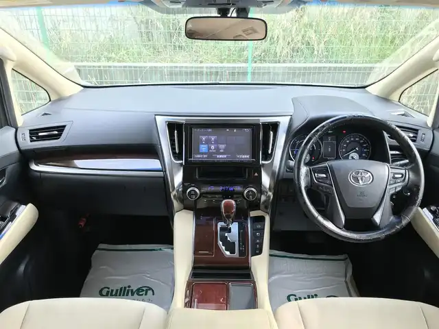 トヨタ ヴェルファイア ハイブリット X 富山県 2015(平27)年 9.8万km グレイッシュブルーマイカメタリック 〇純正ナビ/〇フルセグTV/〇Bluetooth/〇パノラミックビューモニター/〇ビルトインETC/〇ドライブレコーダー/〇パワースライドドア（両側）/〇クルーズコントロール/○コーナーセンサー/〇LEDヘッドランプ/〇オートライト/〇フォグランプ/〇純正16インチアルミ/〇革巻きステアリングホイール/〇前後左右独立オートエアコン/〇スマートエントリー/〇禁煙車