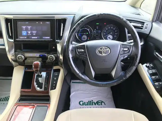トヨタ ヴェルファイア ハイブリット X 富山県 2015(平27)年 9.8万km グレイッシュブルーマイカメタリック 〇純正ナビ/〇フルセグTV/〇Bluetooth/〇パノラミックビューモニター/〇ビルトインETC/〇ドライブレコーダー/〇パワースライドドア（両側）/〇クルーズコントロール/○コーナーセンサー/〇LEDヘッドランプ/〇オートライト/〇フォグランプ/〇純正16インチアルミ/〇革巻きステアリングホイール/〇前後左右独立オートエアコン/〇スマートエントリー/〇禁煙車