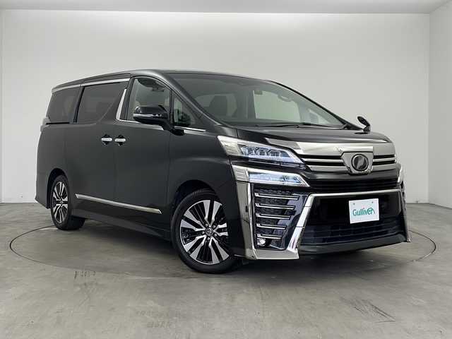 トヨタ ヴェルファイア Z Gエディション 兵庫県 2018(平30)年 7.7万km ブラック ・社外10インチSDナビ（AVIC-CE902VE）/・CD/DVD/BT/SD/フルセグTV/・バックカメラ/・ビルトインETC/・前後ドライブレコーダー/・社外レーダー探知機/・後席モニター２個（carrozzeria)/・両側パワースライドドア/・Toyota　Safety　Sense/・プリクラッシュセーフティ/・レーントレーシングアシスト/・レーダークルーズコントロール/・ロードサインアシスト/・オートマチックハイビームシステム/・クリアランスソナー/・パーキングサポートブレーキ/・デジタルインナーミラー/・ブラインドスポットモニター/・パワーバックドア/・合成皮革シート/・運転席メモリーシート/・前席パワーシート/・前席シートヒーター/・前席ベンチレーション/・ステアリングヒーター/・純正１８インチアルミホイール/・AC100V電源/・3眼LEDオートライト/・LEDフォグランプ/・社外フロアマット（後席部無し）/・シーケンシャルウィンカー/・スマートキー/・スペアキー/・プッシュスタート