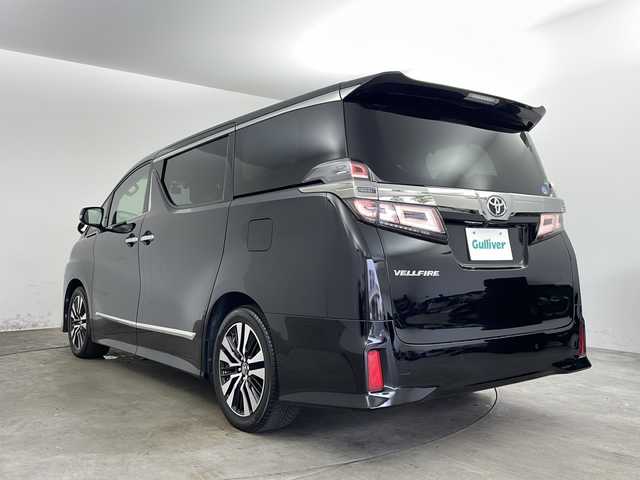 トヨタ ヴェルファイア Z Gエディション 兵庫県 2018(平30)年 7.7万km ブラック ・社外10インチSDナビ（AVIC-CE902VE）/・CD/DVD/BT/SD/フルセグTV/・バックカメラ/・ビルトインETC/・前後ドライブレコーダー/・社外レーダー探知機/・後席モニター２個（carrozzeria)/・両側パワースライドドア/・Toyota　Safety　Sense/・プリクラッシュセーフティ/・レーントレーシングアシスト/・レーダークルーズコントロール/・ロードサインアシスト/・オートマチックハイビームシステム/・クリアランスソナー/・パーキングサポートブレーキ/・デジタルインナーミラー/・ブラインドスポットモニター/・パワーバックドア/・合成皮革シート/・運転席メモリーシート/・前席パワーシート/・前席シートヒーター/・前席ベンチレーション/・ステアリングヒーター/・純正１８インチアルミホイール/・AC100V電源/・3眼LEDオートライト/・LEDフォグランプ/・社外フロアマット（後席部無し）/・シーケンシャルウィンカー/・スマートキー/・スペアキー/・プッシュスタート