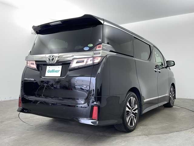 トヨタ ヴェルファイア Z Gエディション 兵庫県 2018(平30)年 7.7万km ブラック ・社外10インチSDナビ（AVIC-CE902VE）/・CD/DVD/BT/SD/フルセグTV/・バックカメラ/・ビルトインETC/・前後ドライブレコーダー/・社外レーダー探知機/・後席モニター２個（carrozzeria)/・両側パワースライドドア/・Toyota　Safety　Sense/・プリクラッシュセーフティ/・レーントレーシングアシスト/・レーダークルーズコントロール/・ロードサインアシスト/・オートマチックハイビームシステム/・クリアランスソナー/・パーキングサポートブレーキ/・デジタルインナーミラー/・ブラインドスポットモニター/・パワーバックドア/・合成皮革シート/・運転席メモリーシート/・前席パワーシート/・前席シートヒーター/・前席ベンチレーション/・ステアリングヒーター/・純正１８インチアルミホイール/・AC100V電源/・3眼LEDオートライト/・LEDフォグランプ/・社外フロアマット（後席部無し）/・シーケンシャルウィンカー/・スマートキー/・スペアキー/・プッシュスタート