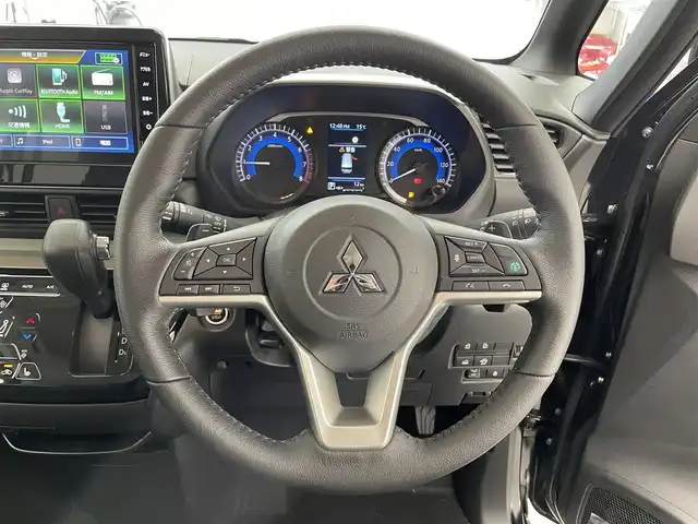 三菱 デリカミニ T プレミアム 滋賀県 2025(令7)年 0.1千km アメジストブラック 純正9インチディスプレイオーディオ/【Bluetooth/Apple CarPlay/Android Auto】/両側パワースライドドア/全方位カメラ/ハーフレザーシート/MI-PILOT/クリアランスソナー/LEDヘッドライト/オートマチックハイビーム/レーンキープアシスト/衝突軽減ブレーキ/ヒルディセントコントロール/D/Nシートヒーター/ステアリングヒーター/デジタルインナーミラー/ルーフレール/電動パーキングブレーキ/オートブレーキホールド/プッシュスタート/スマートキー/ステアリングリモコン