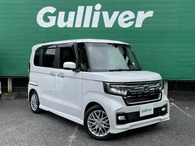 ホンダ Ｎ ＢＯＸ カスタム L ターボ 東京都 2023(令5)年 0.7万km プラチナホワイトパール ターボ/ワンオーナー/純正SDナビ【VXM-234VFi】/（CD/DVD/BTオーディオ/フルセグ）/バックカメラ/ホンダセンシング/・アダクティブクルーズコントロール/・路外逸脱抑制機能/・衝突軽減ブレーキ/・標識認識機能/両側パワースライドドア/ハーフレザーシート/前席シートヒーター/純正フロアマット/前後ドライブレコーダー【DBH-224SD】/ETC/スペアキー×1/取扱説明書/保証書