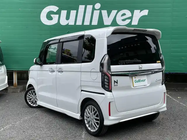ホンダ Ｎ ＢＯＸ カスタム L ターボ 東京都 2023(令5)年 0.7万km プラチナホワイトパール ターボ/ワンオーナー/純正SDナビ【VXM-234VFi】/（CD/DVD/BTオーディオ/フルセグ）/バックカメラ/ホンダセンシング/・アダクティブクルーズコントロール/・路外逸脱抑制機能/・衝突軽減ブレーキ/・標識認識機能/両側パワースライドドア/ハーフレザーシート/前席シートヒーター/純正フロアマット/前後ドライブレコーダー【DBH-224SD】/ETC/スペアキー×1/取扱説明書/保証書