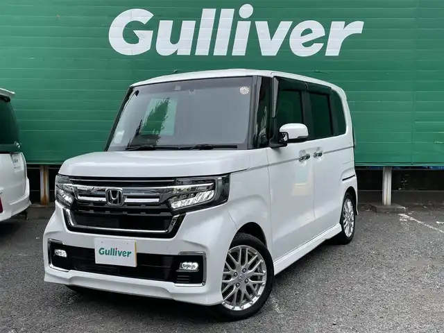 ホンダ Ｎ ＢＯＸ カスタム L ターボ 東京都 2023(令5)年 0.7万km プラチナホワイトパール ターボ/ワンオーナー/純正SDナビ【VXM-234VFi】/（CD/DVD/BTオーディオ/フルセグ）/バックカメラ/ホンダセンシング/・アダクティブクルーズコントロール/・路外逸脱抑制機能/・衝突軽減ブレーキ/・標識認識機能/両側パワースライドドア/ハーフレザーシート/前席シートヒーター/純正フロアマット/前後ドライブレコーダー【DBH-224SD】/ETC/スペアキー×1/取扱説明書/保証書