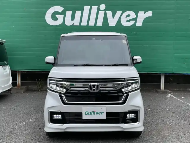 ホンダ Ｎ ＢＯＸ カスタム L ターボ 東京都 2023(令5)年 0.7万km プラチナホワイトパール ターボ/ワンオーナー/純正SDナビ【VXM-234VFi】/（CD/DVD/BTオーディオ/フルセグ）/バックカメラ/ホンダセンシング/・アダクティブクルーズコントロール/・路外逸脱抑制機能/・衝突軽減ブレーキ/・標識認識機能/両側パワースライドドア/ハーフレザーシート/前席シートヒーター/純正フロアマット/前後ドライブレコーダー【DBH-224SD】/ETC/スペアキー×1/取扱説明書/保証書
