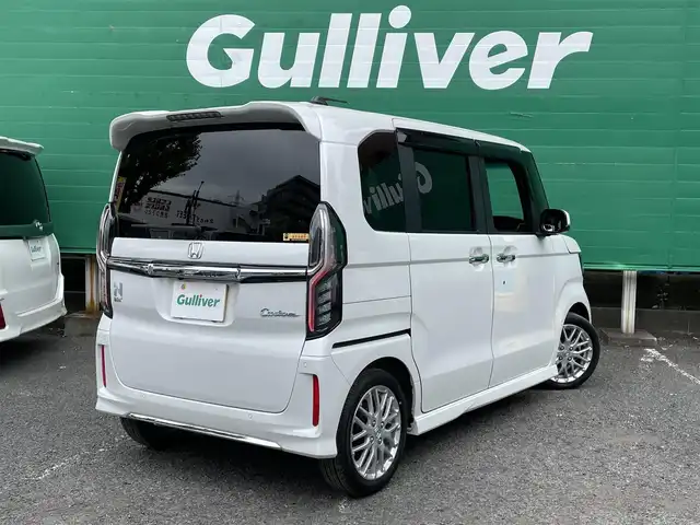 ホンダ Ｎ ＢＯＸ カスタム L ターボ 東京都 2023(令5)年 0.7万km プラチナホワイトパール ターボ/ワンオーナー/純正SDナビ【VXM-234VFi】/（CD/DVD/BTオーディオ/フルセグ）/バックカメラ/ホンダセンシング/・アダクティブクルーズコントロール/・路外逸脱抑制機能/・衝突軽減ブレーキ/・標識認識機能/両側パワースライドドア/ハーフレザーシート/前席シートヒーター/純正フロアマット/前後ドライブレコーダー【DBH-224SD】/ETC/スペアキー×1/取扱説明書/保証書