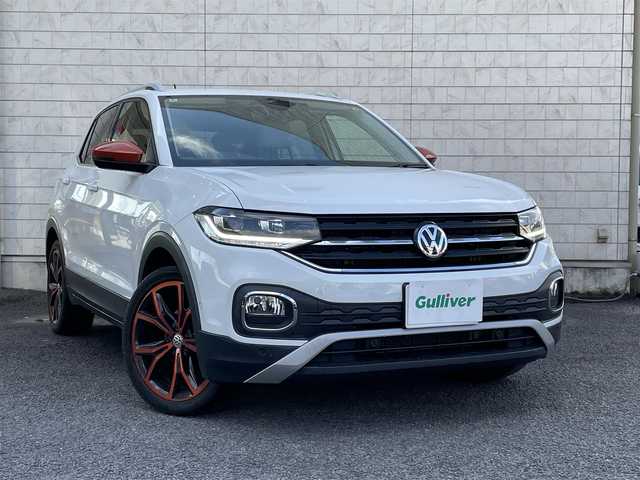 フォルクスワーゲン Ｔ－クロス TSI 1stプラス 大分県 2020(令2)年 3.3万km ピュアホワイト ハーフレザーシート/純正メモリーナビ/　CD/DVD/BT/USB/ラジオ/フルセグ/バックカメラ/ETC2.0/レーンキープアシストシステム/スタティックコーナリングライト /デイタイムランニングライト/ブラインドスポットディテクション（後方死角検知機能）/ドライバー疲労検知システム/パークディスタンスコントロール/リヤトラフィックアラート/プロアクティブ・オキュパント・プロテクション/ESC（エレクトロニック・スタビリティ・コントロール）/ドライブレコーダー（HDR360G)/プッシュエンジン/クリアランスソナー/アイドリングストップ/パーキングアシスト/ステアリングスイッチ/チルステアリング/レベライザー/ウィンカーミラー/ブライングスポット/オートハイビーム/スマートフォンワイヤレスチャージング /リアトラックアシスト/アダプティブクルーズコントロール/純正マット/プライバシーガラス/ルーフレール/保証書/取扱説明書