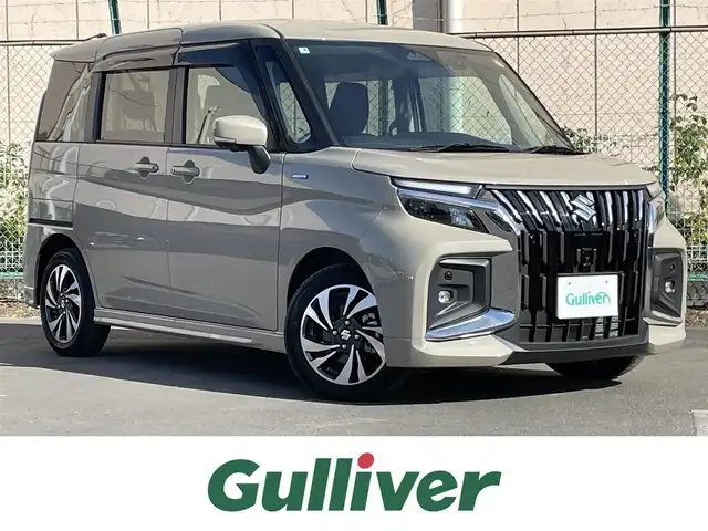 スズキ ソリオ バンディット HV MV 東京都 2025(令7)年 0.3万km キャラバンアイボリーPM ワンオーナー　/純正９型メモリナビ＆フルセグ /・BluetoothAudio/USB/・AppleCarPlay/AndroidAuto/アラウンドビューモニター /両側パワーうスライドドア/純正LEDヘッドライト/ヘッドアップディスプレィ /ブラインドスポットモニター/デュアルセンサーブレーキサポート /LEDヘッドライト /前席シートヒーター/レーンキープアシスト /360°ドライブレコーダー/純正フロアマット/I-STOP/横滑り防止/スマートキー/プッシュエンジンスタート/保証書＆取説