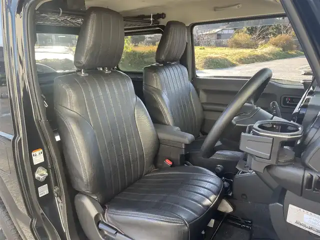 スズキ ジムニー XL 富山県 2024(令6)年 3.3万km ブルーイッシュブラックパール3 革調シートカバー/社外７インチナビ／/フルセグＴＶ／/Ｂｌｕｅｔｏｏｔｈ／/ＤＶＤ再生／/リフトアップサスペンション／/社外マフラー／/ＥＴＣ／/シートヒーター／/スマートキー／/プッシュスタート／/室内ルーフキャリア