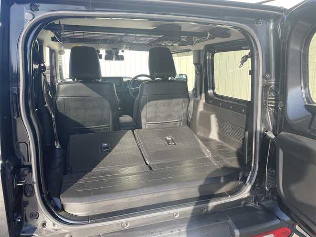 スズキ ジムニー XL 富山県 2024(令6)年 3.3万km ブルーイッシュブラックパール3 革調シートカバー/社外７インチナビ／/フルセグＴＶ／/Ｂｌｕｅｔｏｏｔｈ／/ＤＶＤ再生／/リフトアップサスペンション／/社外マフラー／/ＥＴＣ／/シートヒーター／/スマートキー／/プッシュスタート／/室内ルーフキャリア